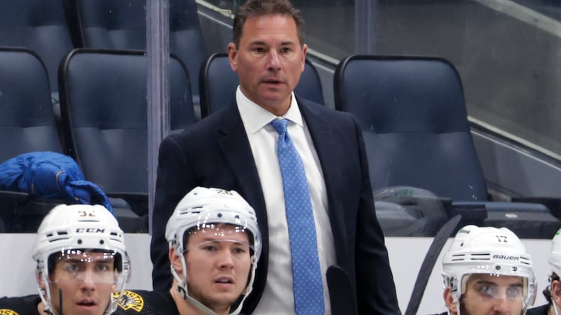 FILE - Boston Bruins coach Bruce Cassidy watches during the third period of the team's NHL...