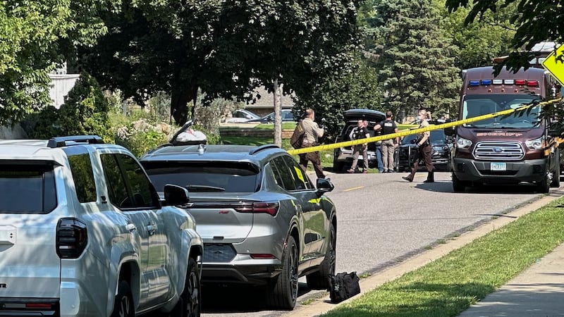 Law enforcement respond to a call at a home daycare, Wednesday, Aug. 12, 2026, in Hopkins, Minn.
