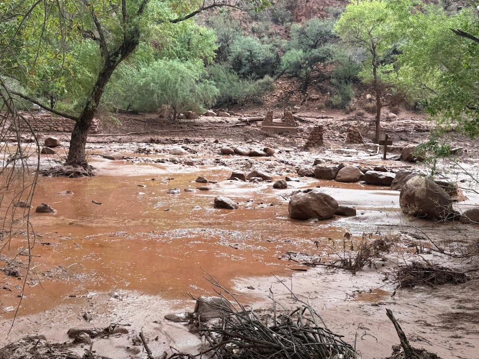 Remnants of stone bridge pylons remain along Bright Angel Creek following a flash flood that...