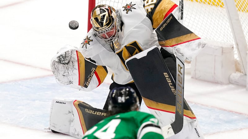 Vegas Golden Knights goaltender Logan Thompson (36) blocks a shot by Dallas Stars center Roope...