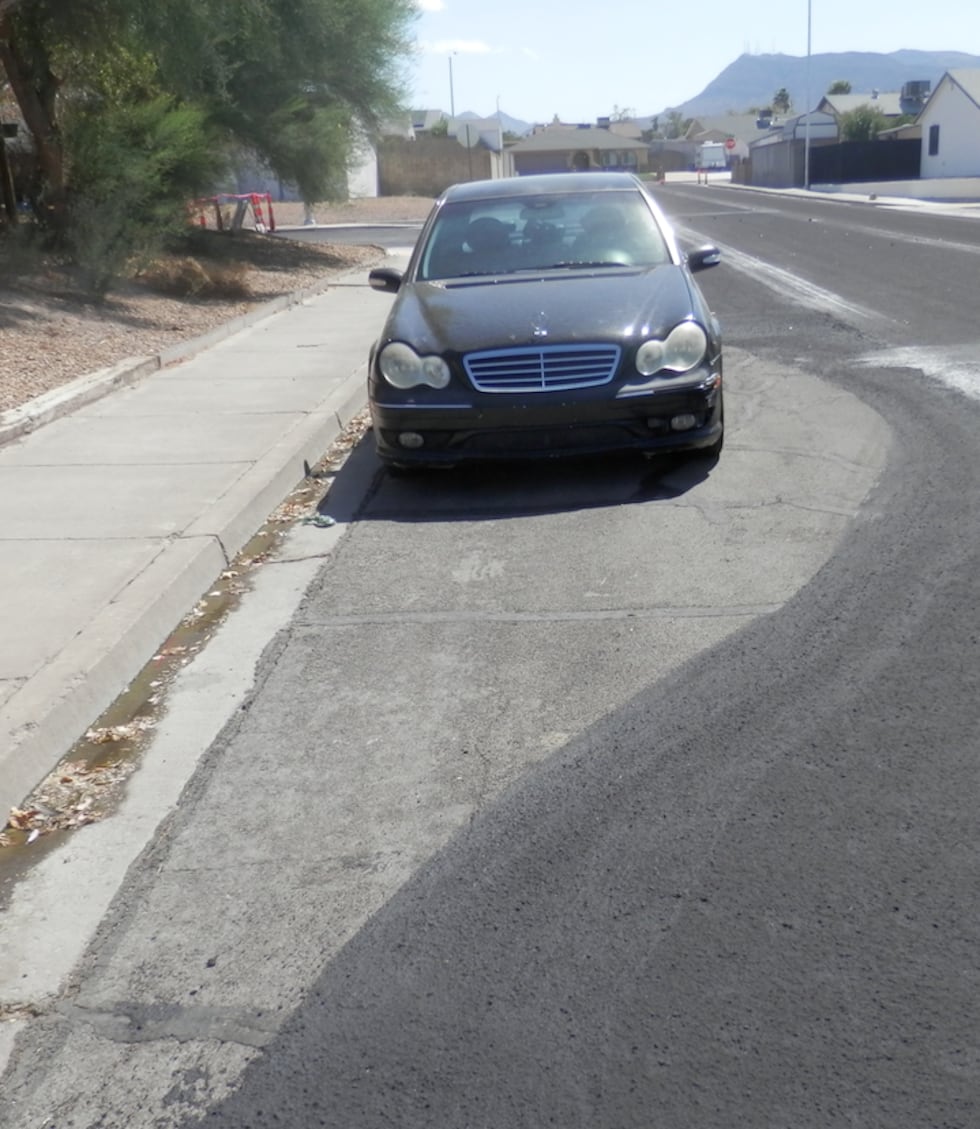 Neighbors say this car was paved around by the City of Henderson, after multiple notices were...