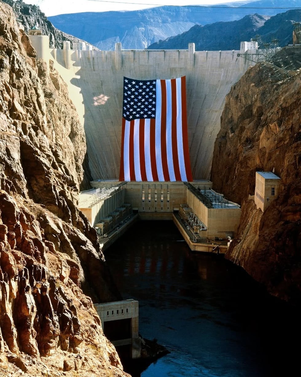 A large American Flag is placed at the Hoover Dam.