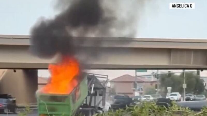 A dumpster on the back of a truck caught fire in Las Vegas near I-11 and Sunset.