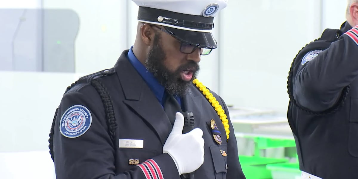 TSA officers at Harry Reid International Airport pause for moment of silence honoring 9/11 victims and fallen first responders; ceremony held at Terminal 1 A/B checkpoint